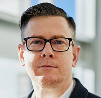 Alexander Hughes, generální ředitel a vedoucí představitel firmy obchodující s kryptoměnami, portrét